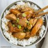 Bourbon Chicken served over rice in a bowl.