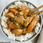 overhead photo of a bowl of Bourbon Chicken over rice