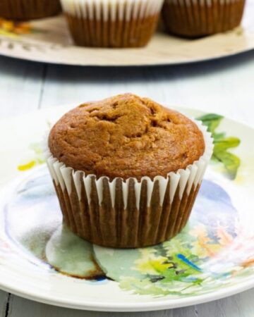 Close up photo of a Pumpkin Spice Peanut Butter Muffin on a Fall plate