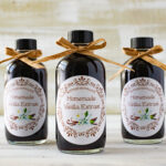 Closeup of 3 bottles of homemade vanilla extract