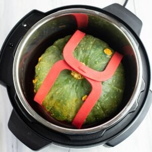 Overhead photo of a Kabocha squash inside the Instant Pot before cooking.