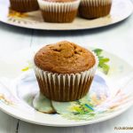 Close up photo of a Pumpkin Spice Peanut Butter Muffin on a Fall plate