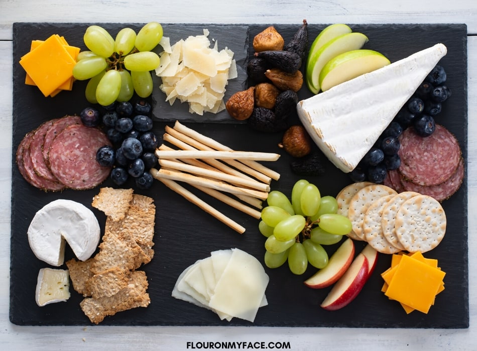 Showing how to arrange a cheese board