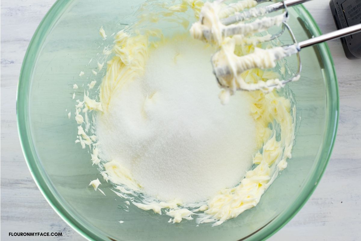 Creaming butter and sugar together in a bowl.