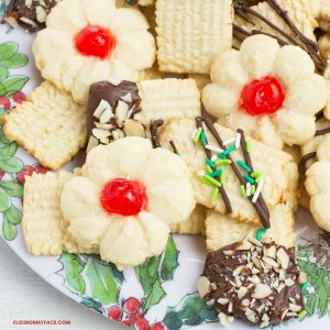 A holiday plate with a variety of German Christmas cookies made with a German Spritz Cookies recipe