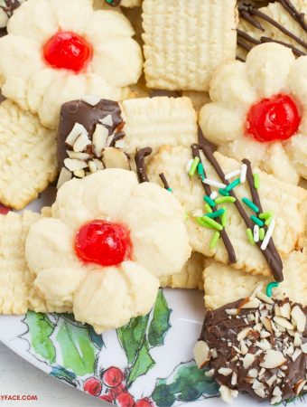A holiday plate with a variety of German Christmas cookies made with a German Spritz Cookies recipe