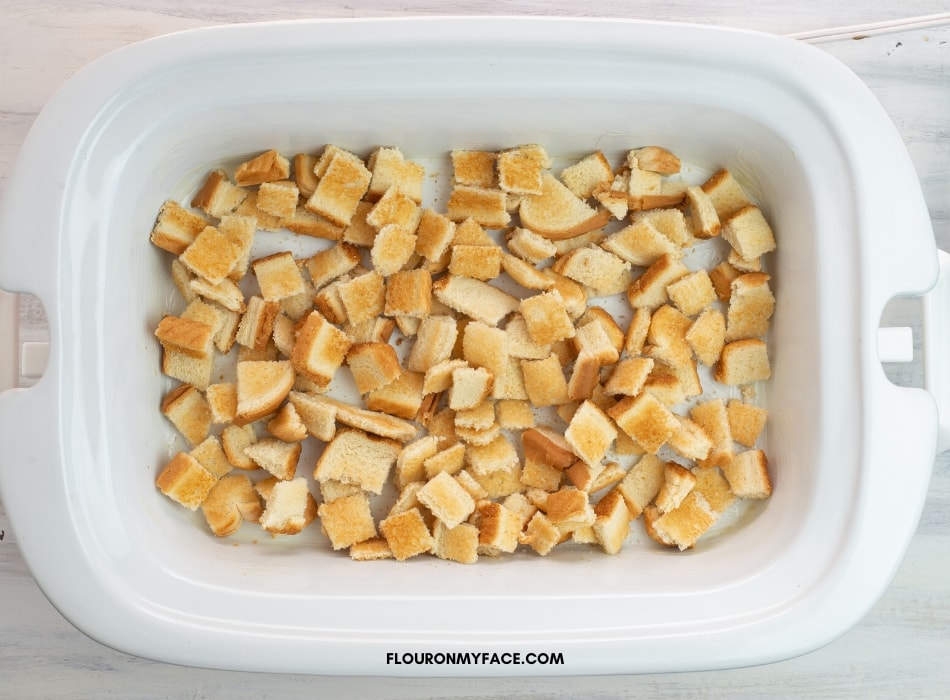 Toasted Bread cubes in a single layer in the crock pot