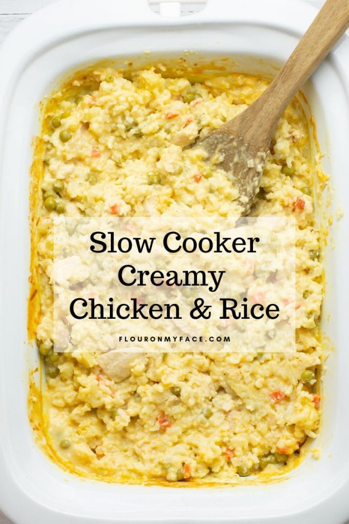 a crock pot filled with slow cooked creamy chicken and rice