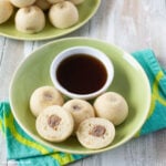 Instant Pot Pancake Sausage Bites in a bowl with a small bowl of syrup