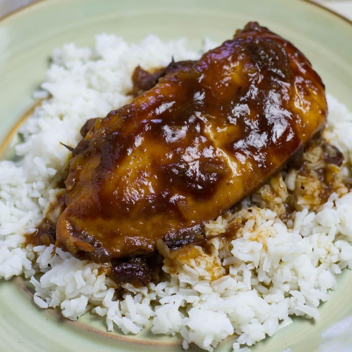 Crock Pot BBQ Craberry Chicken served over white rice.