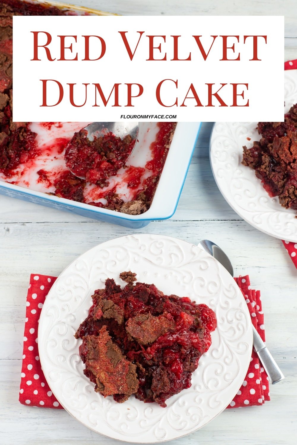 a serving of Red Velvet Dump Cake recipe on a white dessert plate with a red and white polka dot cloth napkin. The baking dish visible in the background.