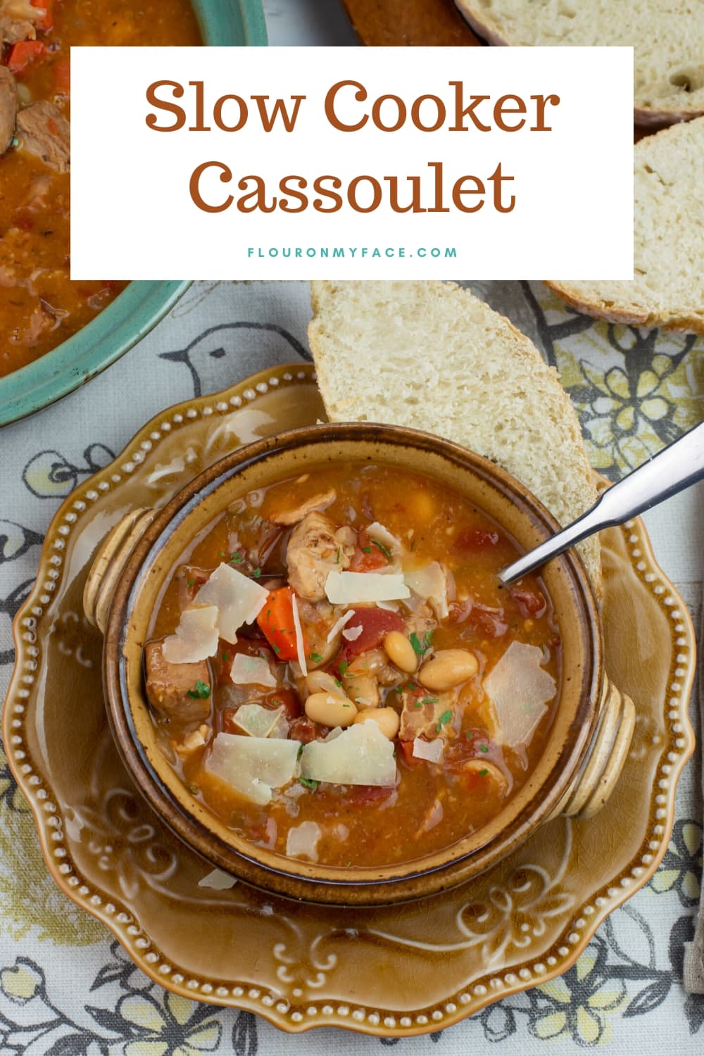 slow cooked Cassoulet in a brown crock served with rustic bread.