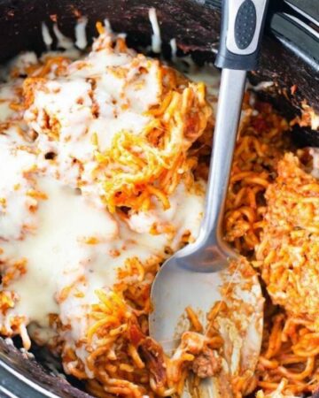 Overhead photo of baked spaghetti in a crock pot.
