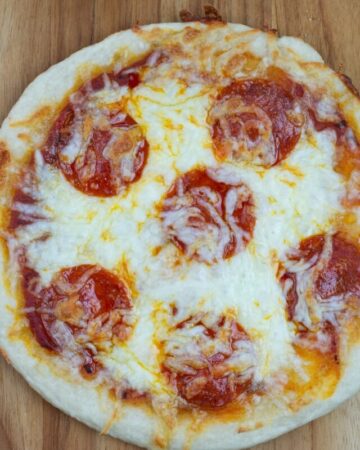 Deep dish personal pan pizza made with sourdough pizza dough made from sourdough starter discard