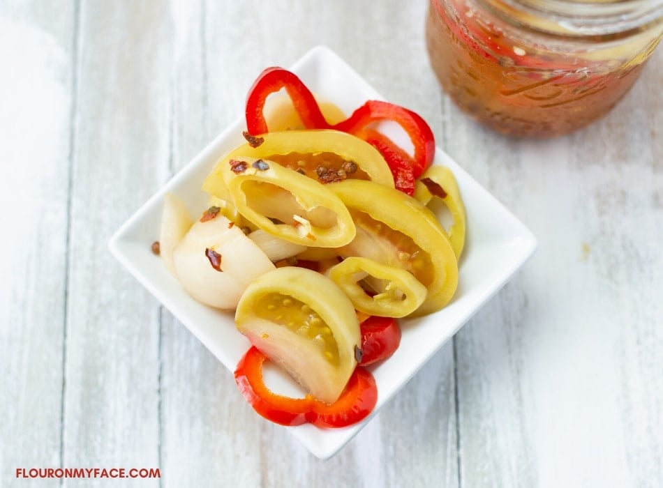 Quick Pickled Tomatoes, Peppers and onions in a small white condiment bowl