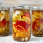 a mason jar filled with Quick Pickles Tomatoes and Peppers
