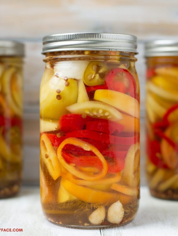 a mason jar filled with Quick Pickles Tomatoes and Peppers