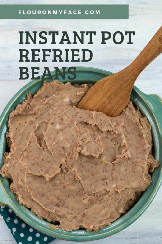 Family size serving bowl of refried beans that have been made in the pressure cooker