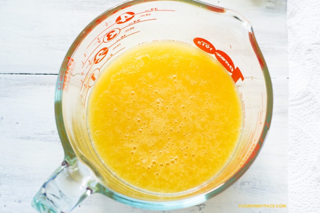 a spouted glass measuring cup filled with starfruit juice