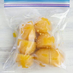 Cubes of frozen carambola juice in a freezer bag