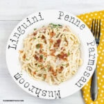 Smoked Gouda Alfredo Sauce with bacon served over linguine pasta in a white serving bowl