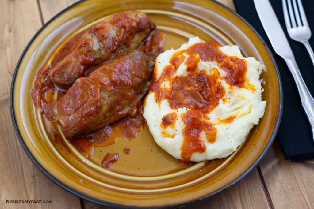 Stuffed Cabbage Rolls served with mashed potatoes and a tomato based sauce