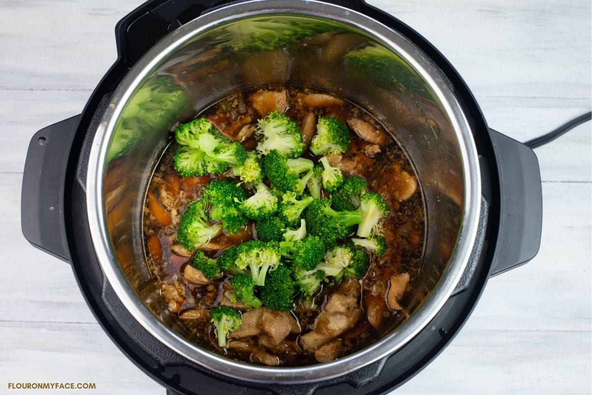 over head looking down into the Instant Pot at chicken and broccoli