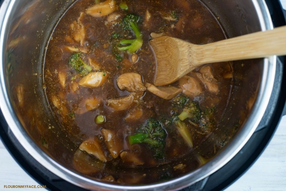 Thickening the sauce for chicken and broccoli in side the Instant Pot on sauté