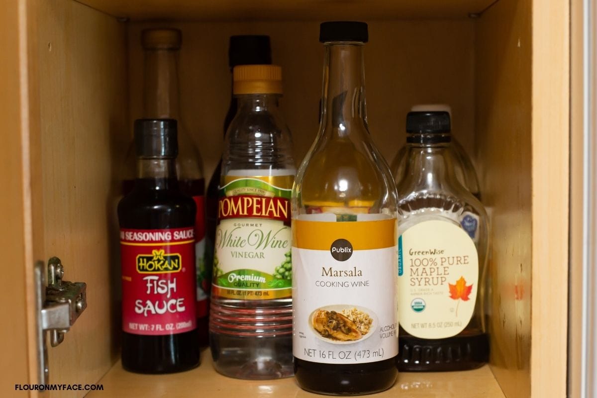 bottle of cooking wine in kitchen cabinet