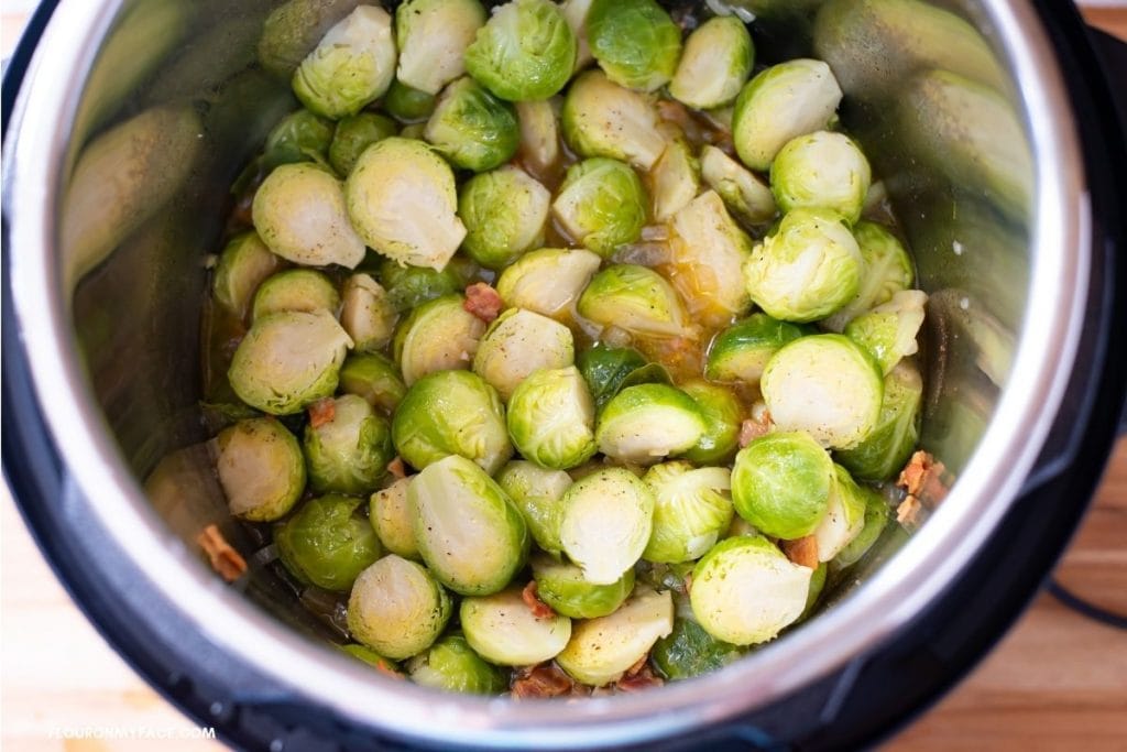 Overhead photo of pressure steamed cooked Brussels sprouts inside the pot of an Instant Pot.