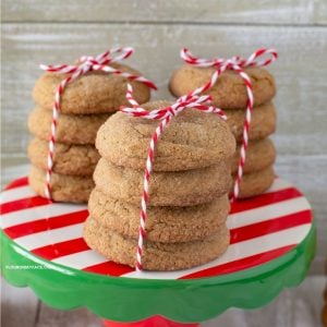 3 stacks of Ginger Cookies on a red, white and green cake stand.