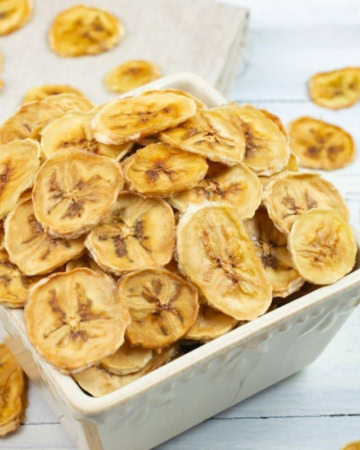 a small bowl filled with dehydrated banana chips.