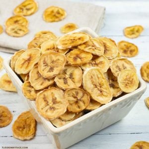 a small bowl filled with dehydrated banana chips.