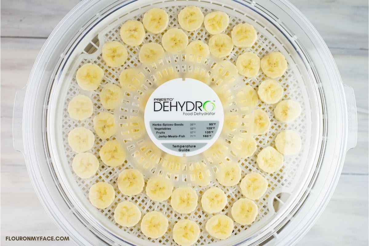 Dehydrator loaded with banana chips.