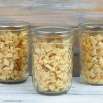 Dehydrated Diced Apple Pieces in small mason jars.
