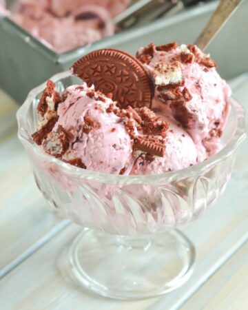 Red velvet ice cream in a glass dessert dish.