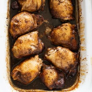 Balsamic Chicken Thighs in a shallow crock.