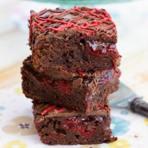 3 stacked cherry filled brownie bars.