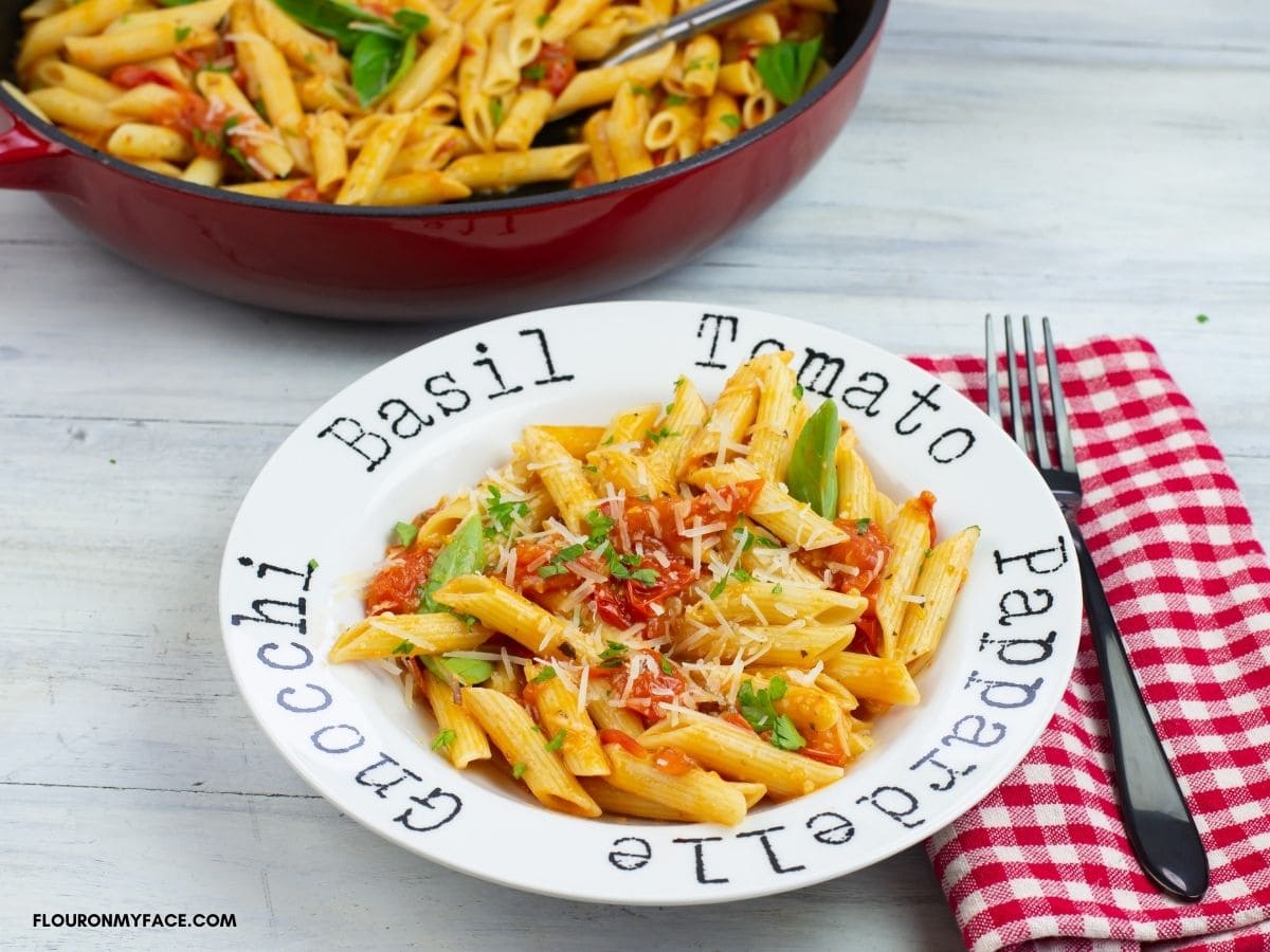 A pasta bowl filled with Penne pasta tossed with homemade tomatoes sauce.