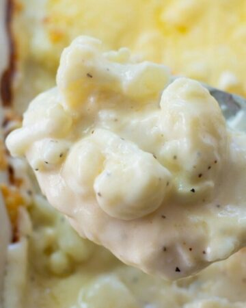 A closeup photo of a spoonful of cauliflower casserole.