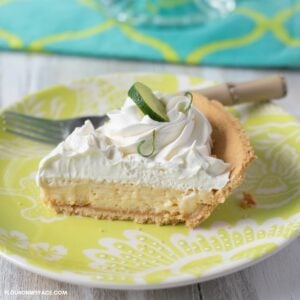 A slice of key lime pie on a plate.