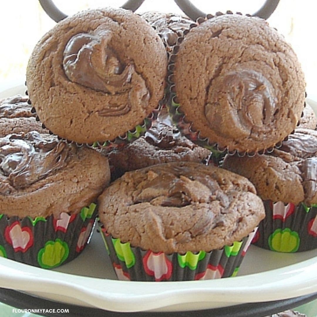 A pile of Nutella Muffins on a plate.