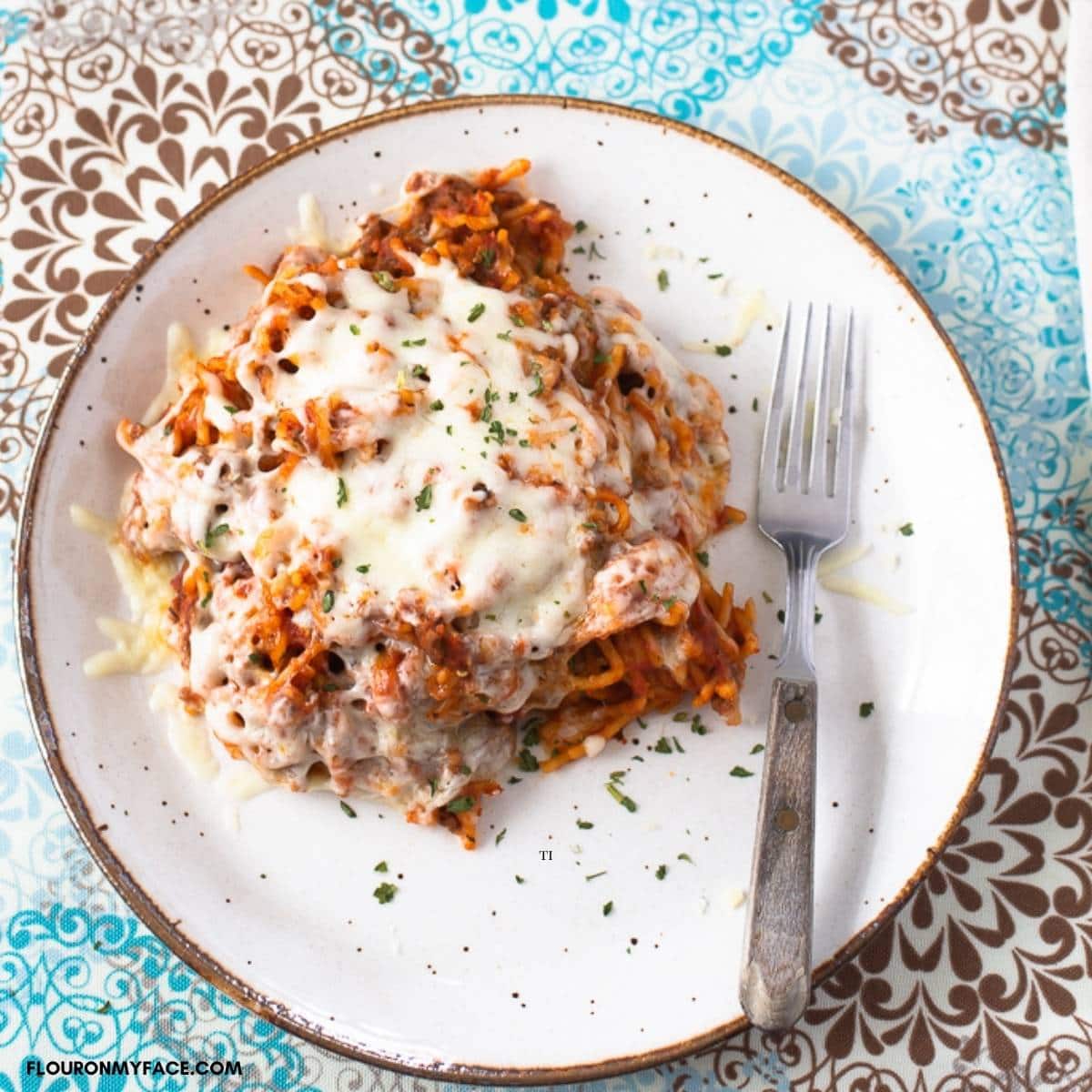 A serving of Crock Pot Cheesy Beef Spaghetti on a plate.