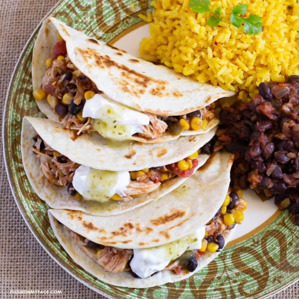 Crock Pot Salsa Chicken recipe served with rice on a plate.