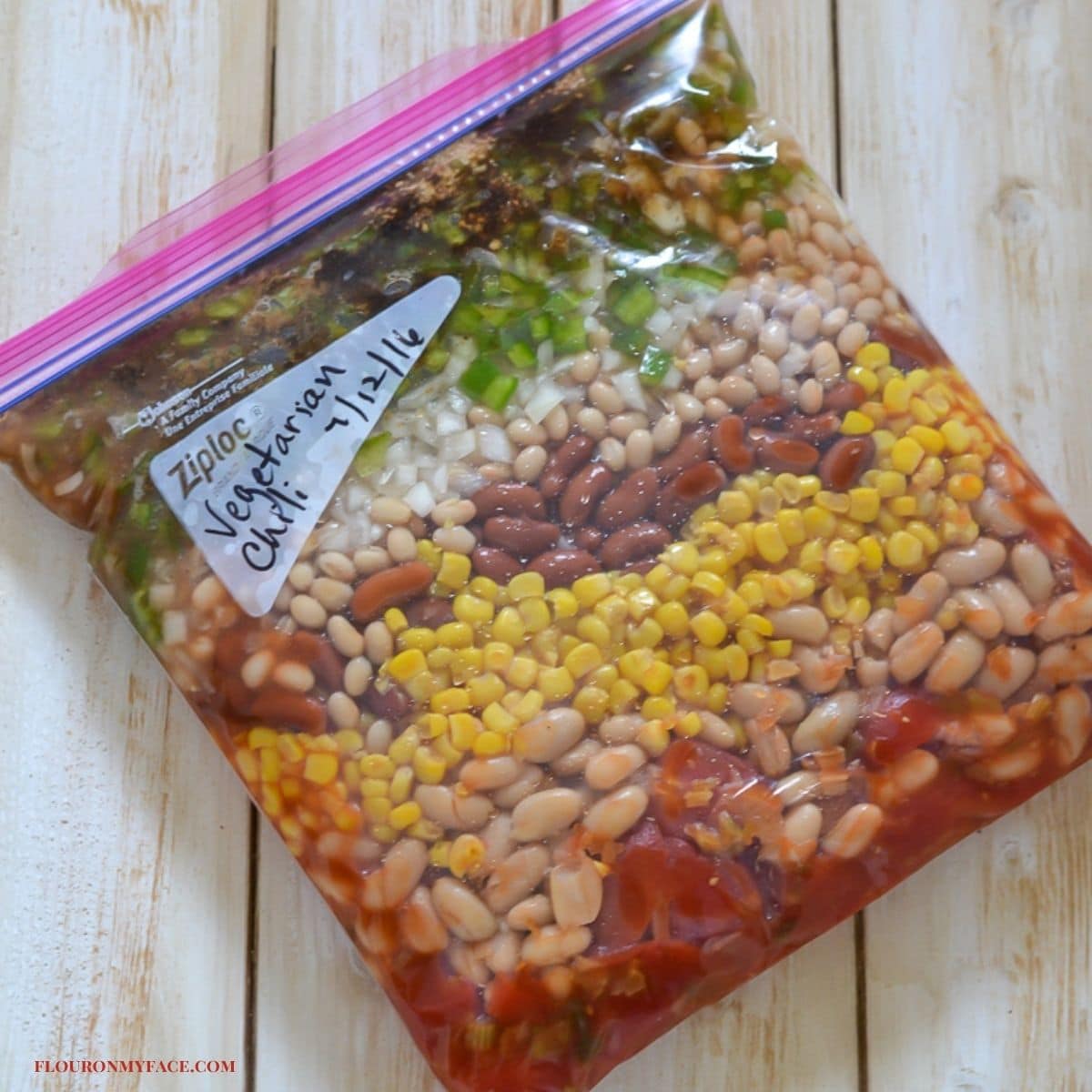 Vegetarian chili ingredients layered in a freezer bag.