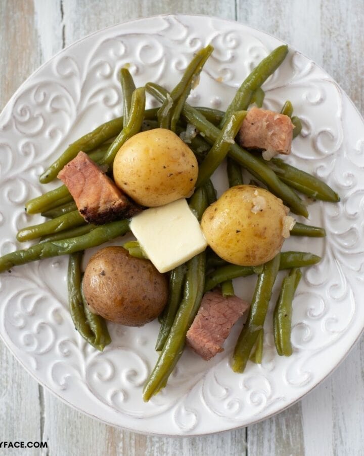 Green beans and baby potatoes on a plate.