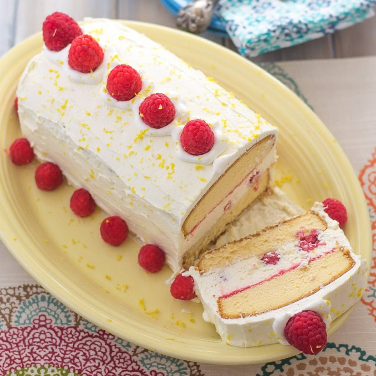Raspberry and Lemon curd ice box cake on a serving platter.