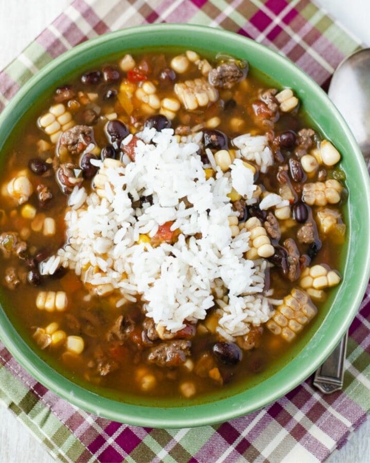 Black Bean and corn soup in a soup bowl on top of a napkin.