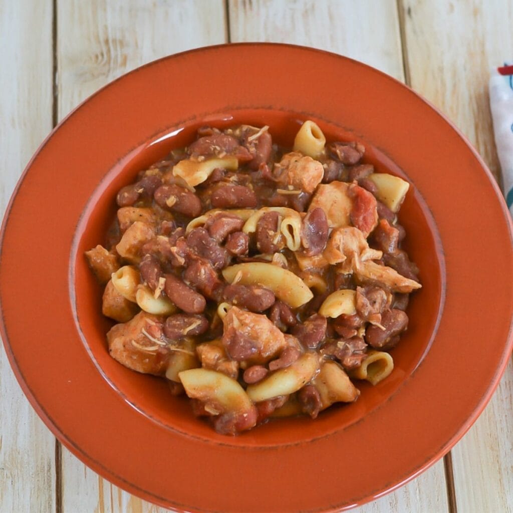 A bowl filled with chicken chili mac.