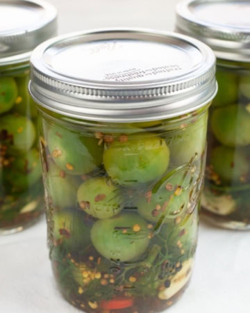Pickled green cherry tomatoes.